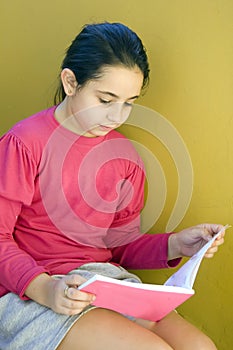 Girl reading on the stairs