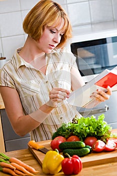 Girl reads a cookbook photo
