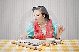 Girl reads a cookbook