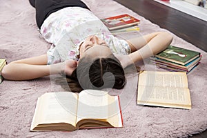 Girl realxed in her romm, without books