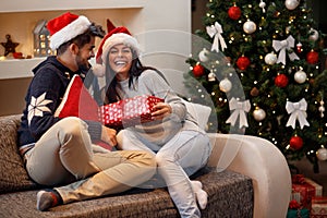 Girl receive present from boy for holiday photo