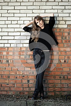 Girl recline on wall