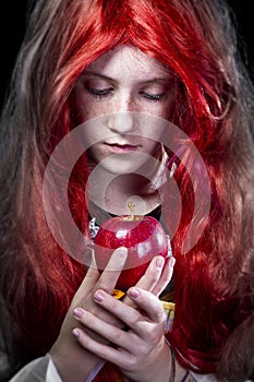 Girl with red apple in a poetic representation photo