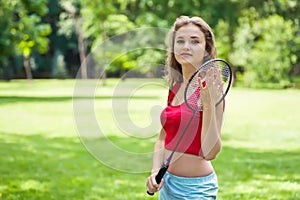 Girl in red with badminton rocket