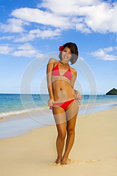 Girl in a red bikini on a Hawaii beach