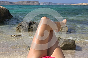 the girl in red bikini relaxed on the greek beach