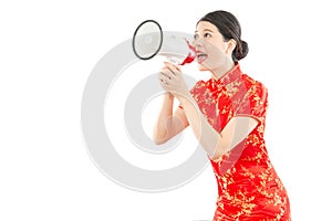 Girl in red cheongsam holding loud speaker