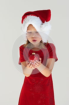 Girl and red christmas ball