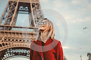 Girl in red coat and bag at parisian street