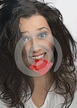 Girl with with red condom pack