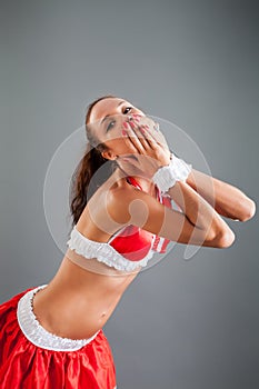 Girl in Red Dance Costume Bends Body Sends Air Kiss