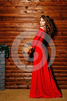 Girl in red dress with flowers