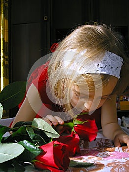 Girl in red dress and roses