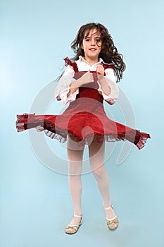 Girl in red dress spinning