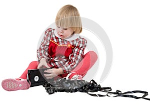 Girl in the red dress with video cassette photo