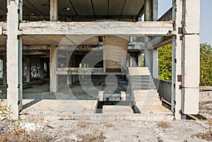 The girl with red hair in an abandoned factory building