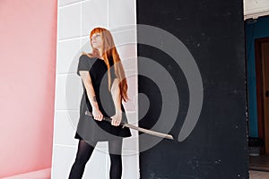 Girl cosplayer with red hair anime japan sword