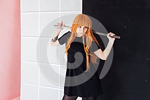 Girl cosplayer with red hair anime japan sword