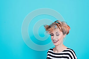 Girl with red hair holding her head shouting. Stress and hysterical. negative emotions. Studio shot.