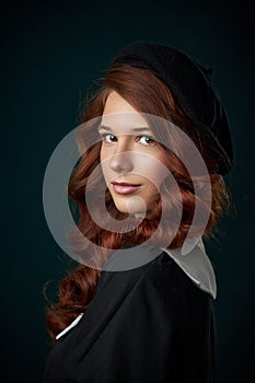 Girl with red hair studio beauty portrait