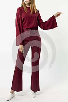 a girl in a red pantsuit