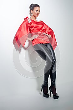 Girl in red silk tunic and black leggings