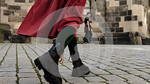 Girl In Red Skirt Strolls Through Historic European City Area