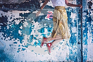 Girl with red sneakers jumping