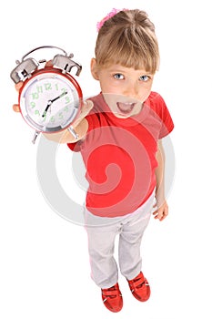 Girl in red t-shirt and alarm clock.