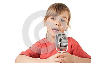 Girl in red T-shirt sing in old style microphone photo