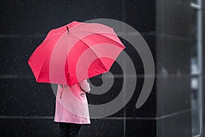 Girl with red Umbrella on rainy day
