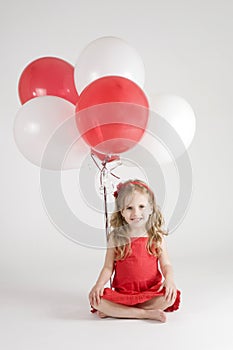 Girl with red and white balloons photo