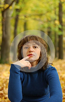 The girl reflecting in an autumn wood