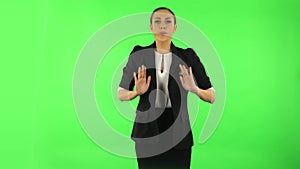 Girl refuses stress and takes situation, calms down, breathes deeply. Green screen