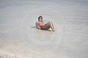 Girl relax in transparent water