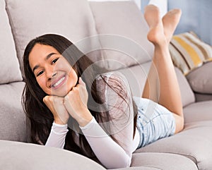 Girl relaxation at home on comfortable sofa