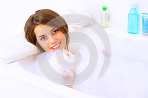 Girl relaxing in bathtub