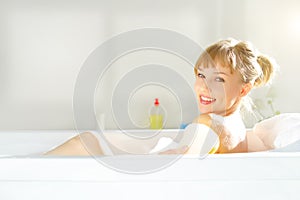 Girl relaxing in bathtub