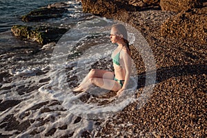 Girl relaxing on the beach. Summer holiday idyllic on a tropical island