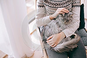 Girl relaxing with cat at home