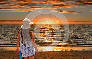 Girl relaxing on the golden beach.