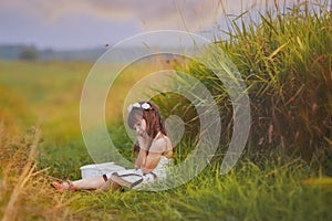 Girl relaxing in grass