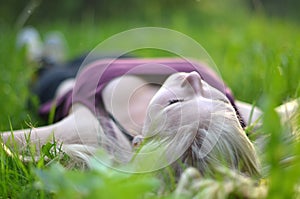 Girl relaxing in the grass