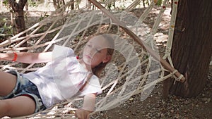 Girl relaxing in hammock