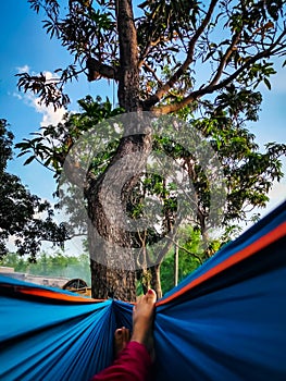 Girl relaxing on hammock at holiday