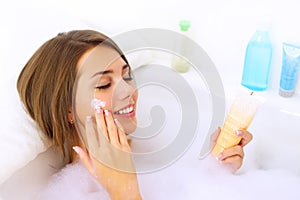 Girl relaxing in her bathtub