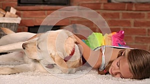 Girl relaxing with her playful dog