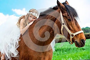 Girl relaxing on horseback.