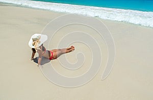 Girl relaxing at paradise beach in Seychelles, island Praslin - Anse Lazio