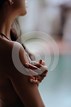 Girl relaxing in the pool on luxury villa in Bali.